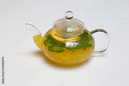 Yellow tea teapot mint and orange tea 