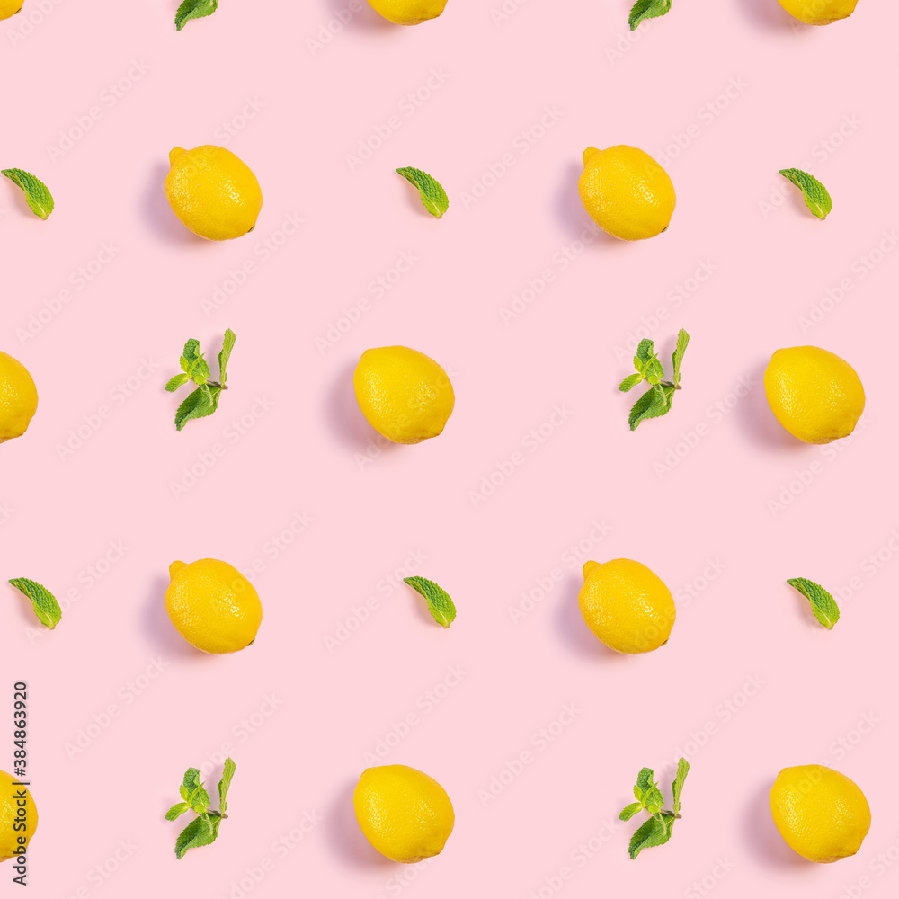 Bright pattern of fresh whole lemons and mint on a pink background. Citrus, vitamin C, fruit. Bright pattern of fresh whole lemons and mint on a pink background. Citrus, vitamin C, fruit.