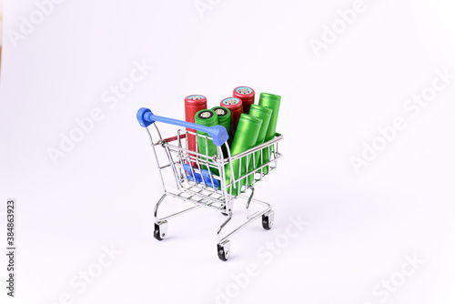 Li ion 18650  battery in the shopping cart, on the white background. © Homestudio