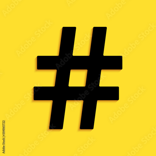 Black Hashtag icon isolated on yellow background. Social media symbol. Modern UI website navigation. Long shadow style. Vector.