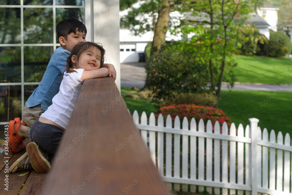 Happy kids on the deck in backyard Happy kids on the deck in backyard