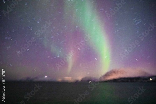 Northern light view from moving ship photo