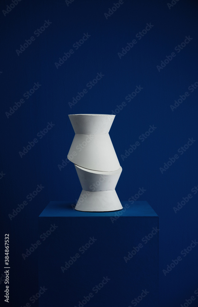Abstract art sculpture / plaster / stone on dark blue background. Abstract art sculpture / plaster / stone on dark blue background.