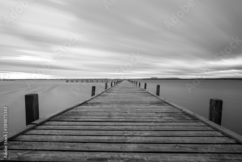 wooden pier with clouds