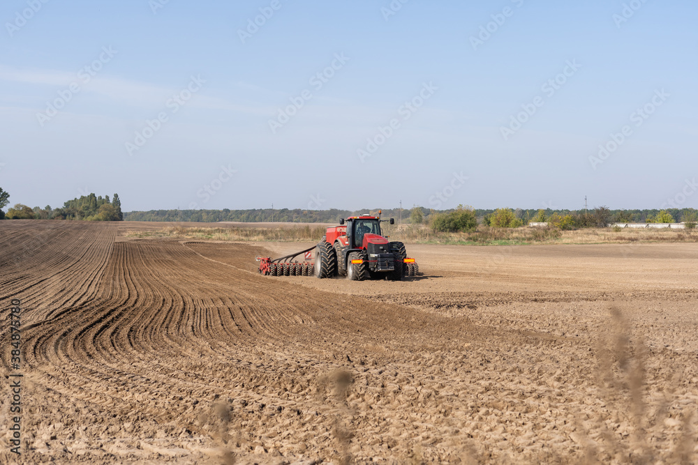 Obraz premium Tractor on a farmer field