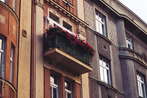 Photography beautiful Prague balcony filled with flowers on a classic eastern european facad
