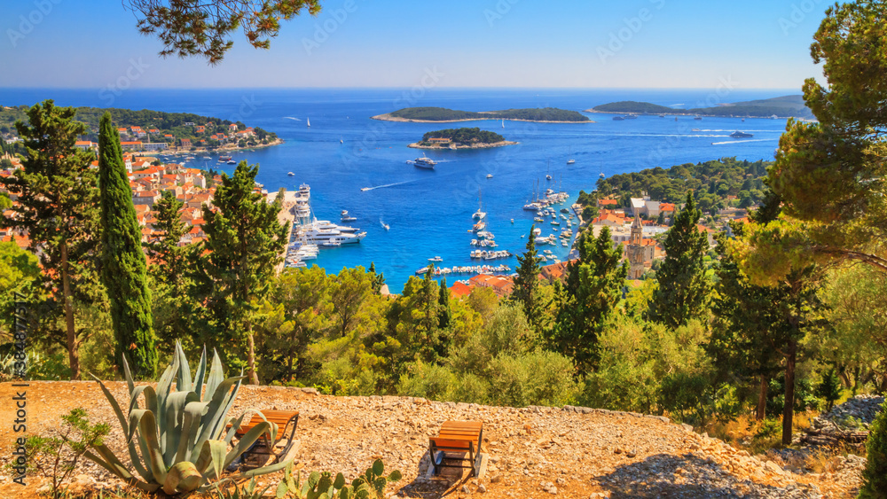 Coastal summer landscape - top view of the City Harbour of the town of Hvar and the Paklinski Islands, the island of Hvar, the Adriatic coast of Croatia