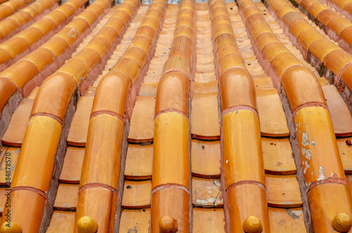 Detail of the orange tiles on the roof on traditional Chinese house