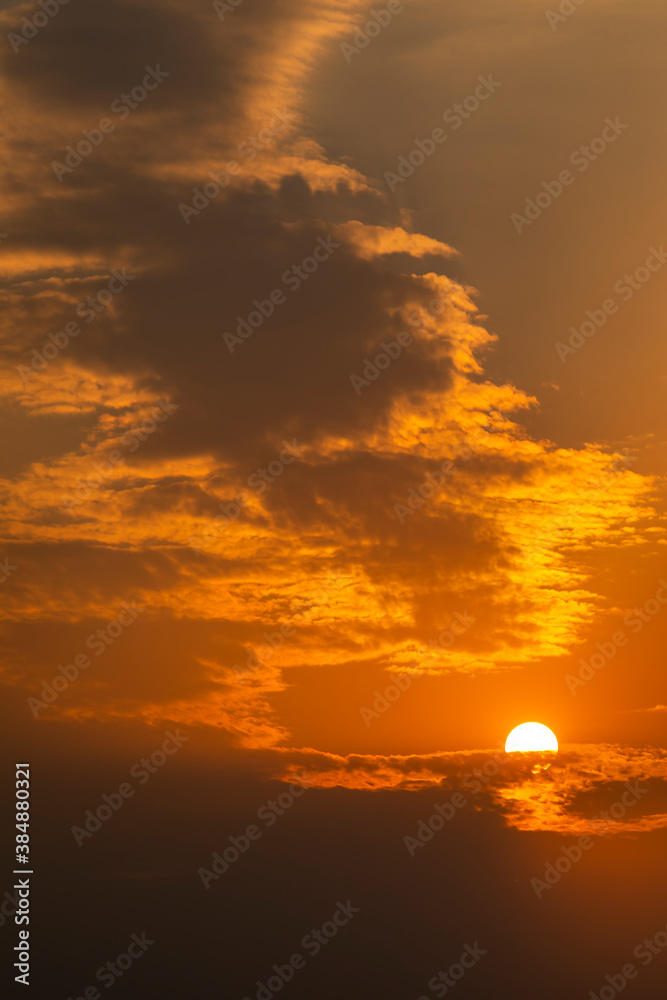 Fototapeta premium golden orange clouds at sunset background