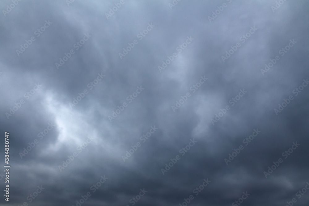 Gloomy dark heavy storm clouds. Dramatic natural background Gloomy dark heavy storm clouds. Dramatic natural background