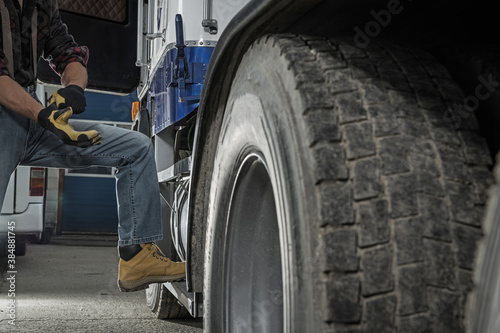 Trucker Preparing His Semi Truck For the Next Heavy Duty Delivery © Tomasz Zajda