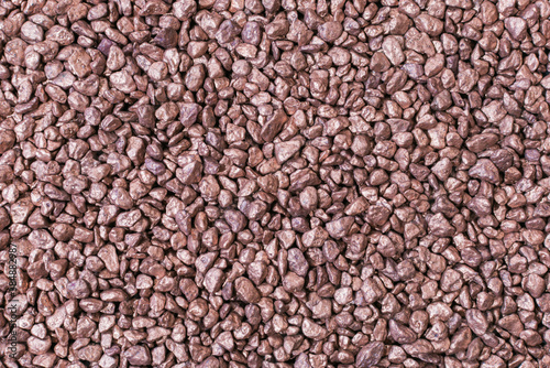 heap of small bronze nuggets background