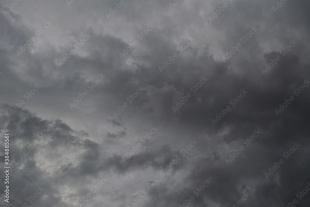 Dramatic sky with light and dark grey stormy clouds.