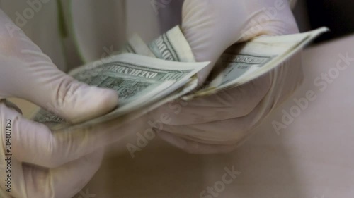 Close Up of Banker Hands Counting Money. Teller Works with Cash in Protective Gloves. Clerk Counting Dollars Cash Money. Cashier Recounts American Banknotes. Bank Cash Department. One Hundred Dollar