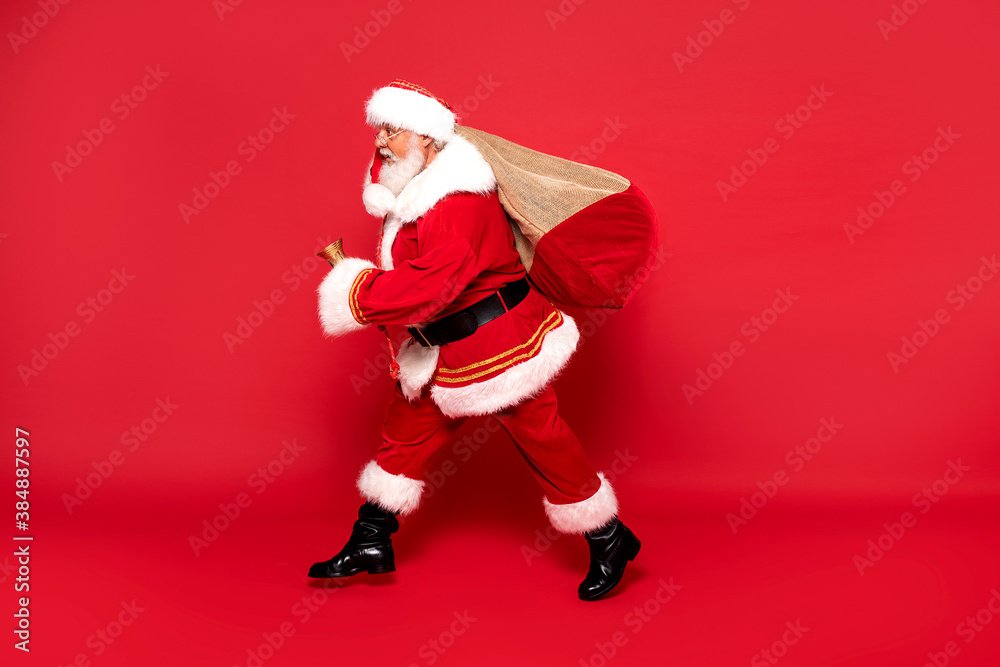 Funny Santa Claus holding sack bag with Merry Christmas presents. Funny Santa Claus holding sack bag with Merry Christmas presents.