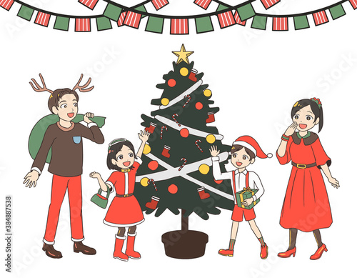 クリスマスツリーを取り囲む家族　緑