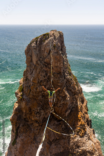 Beautiful view to male highliner on beautiful rocky shore landscape photo