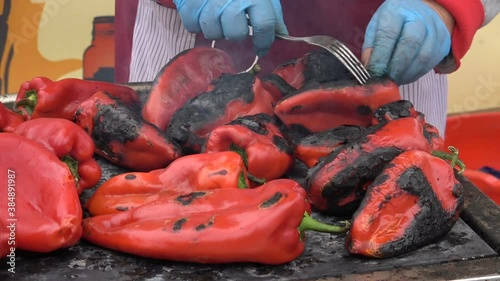 Grilling red peppers on metal plate on wood burning stove - Traditional preparing delicious food in Serbia.
Roasted red peppers on the barbecue. Close up.
