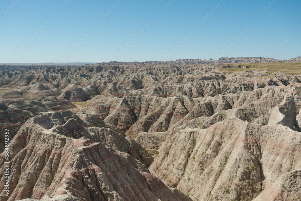 Layered Rock formations, steep Canyons and towering Spires of Badlands National Park in South Dakota. USA. Layered Rock formations, steep Canyons and towering Spires of Badlands National Park in South Dakota. USA.