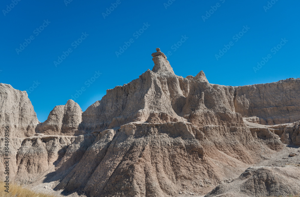 Layered Rock formations, steep Canyons and towering Spires of Badlands National Park in South Dakota. USA.