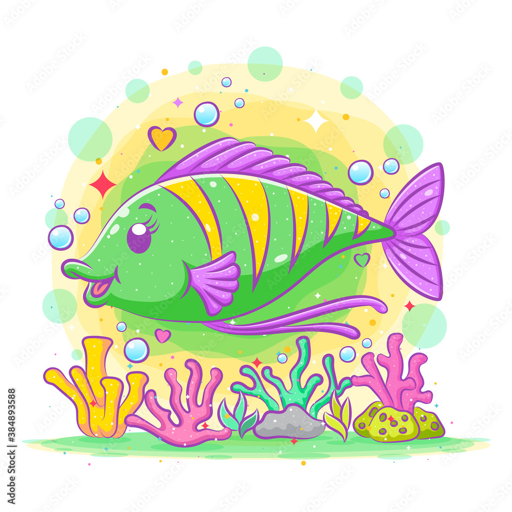 Cute green surgeon fish poses above the colorful coral reefs