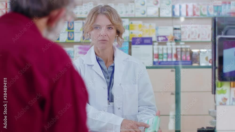 Portrait woman pharmacist serving a customer in a drugstore. Conversation pharmaceutical client. Seller commercial health care buyer uniform. Slow motion Portrait woman pharmacist serving a customer in a drugstore. Conversation pharmaceutical client. Seller commercial health care buyer uniform. Slow motion