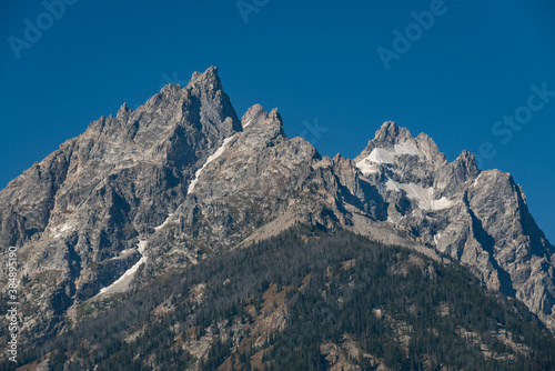 The Teton Range of the Rocky Mountains in North America. Jenny Lake Trail in Grand Teton National Park  Wyoming. USA. Back to Nature concept.