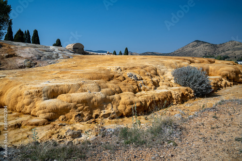 Captive geyser in Soda Springs Idaho. Mineral terraces of the hot springs photo