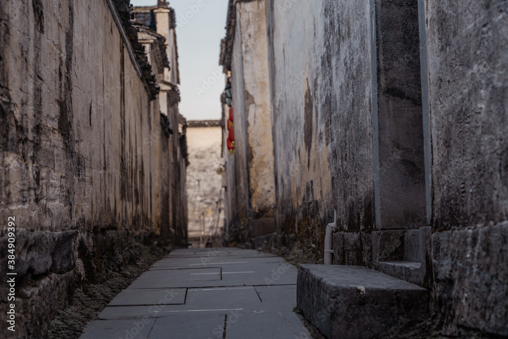 Sunrise view of the streets and architectures in Xidi village, an ancient Chinese village in Anhui Province, China, a UNESCO world cultural heritage site. Sunrise view of the streets and architectures in Xidi village, an ancient Chinese village in Anhui Province, China, a UNESCO world cultural heritage site.