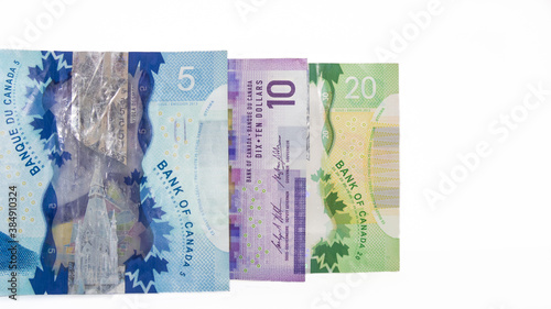 Isolated view of a five, ten and twenty canadian dollar bill photo