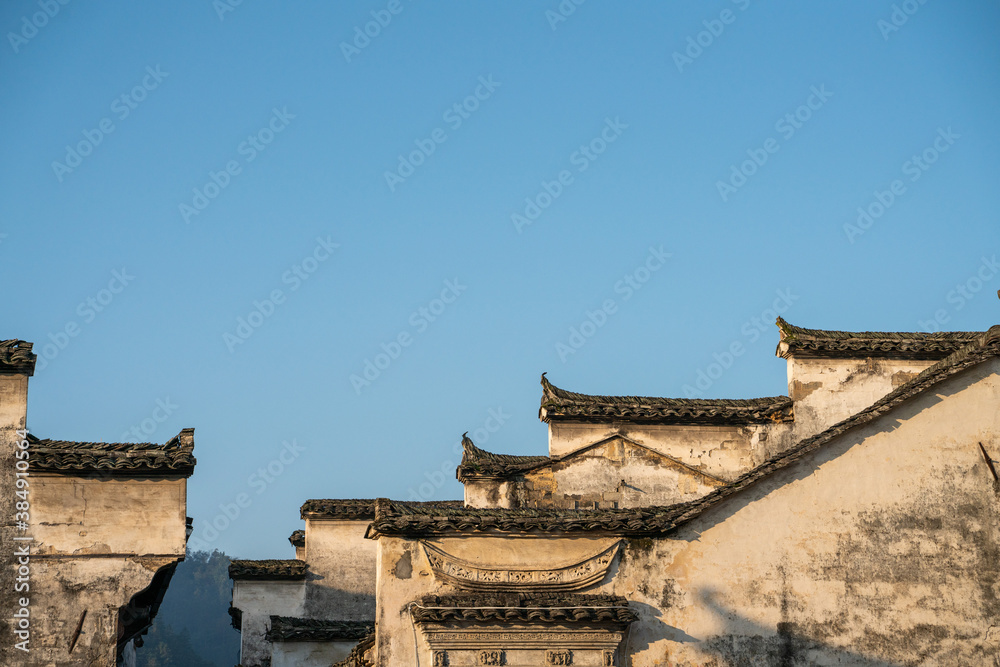 Sunrise view of the architectures in Xidi village, an ancient Chinese village in Anhui Province, China, a UNESCO world cultural heritage site. Sunrise view of the architectures in Xidi village, an ancient Chinese village in Anhui Province, China, a UNESCO world cultural heritage site.