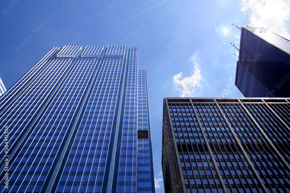 Low angle shot of modern glass city buildings Low angle shot of modern glass city buildings