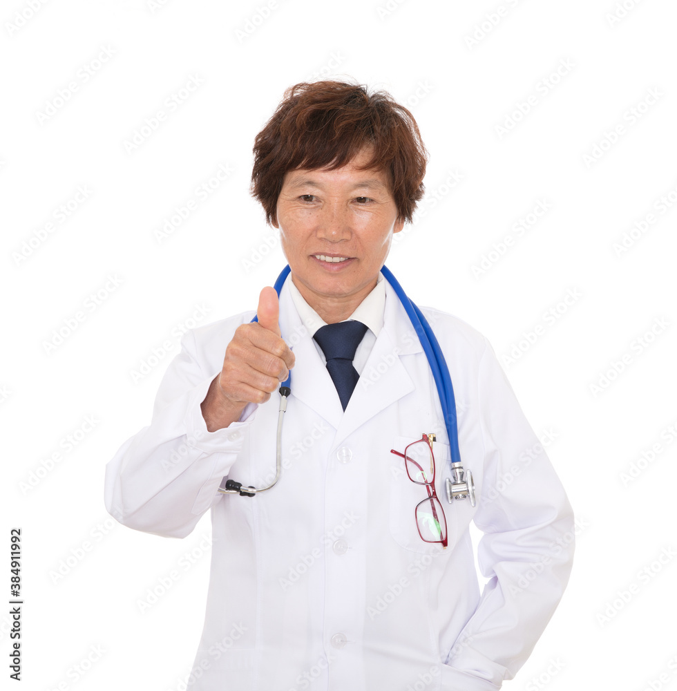 Female doctor in white coat shows appreciation with thumbs up Female doctor in white coat shows appreciation with thumbs up