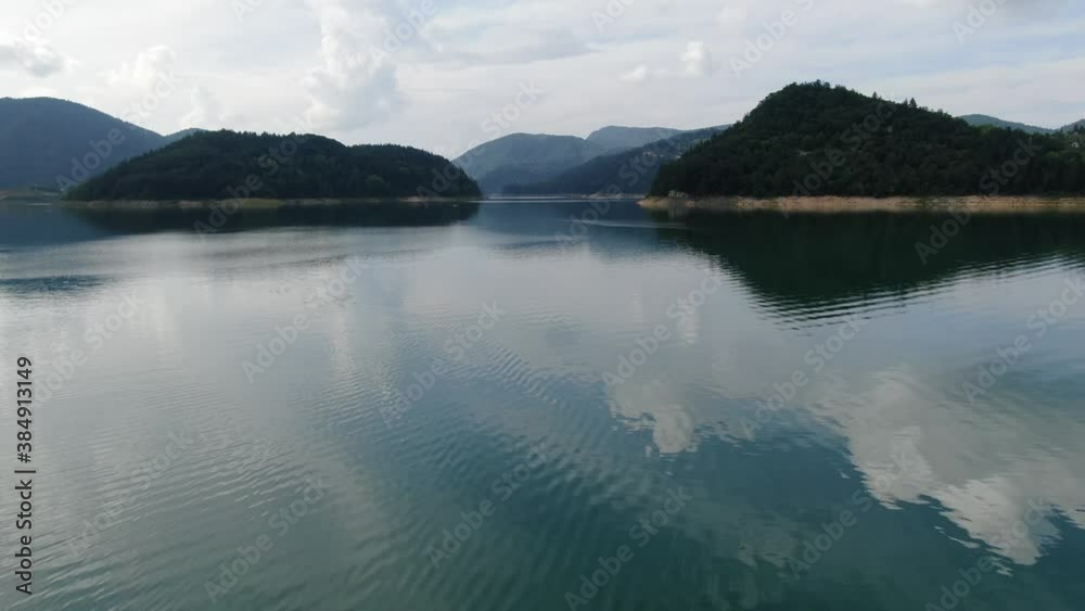 Zaovine Lake, Serbia. Aerial View of Artificial Water Reservoir in Tara Mountain National Park and Mirror Reflection on Surface Zaovine Lake, Serbia. Aerial View of Artificial Water Reservoir in Tara Mountain National Park and Mirror Reflection on Surface