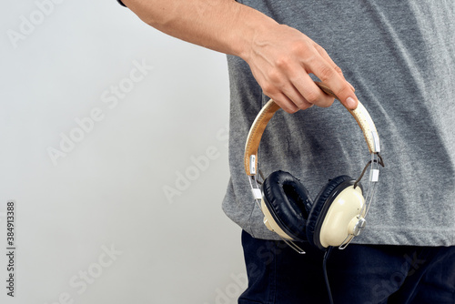 Man holding headphones in the hands of a man lifestyle modern style technology cropped view