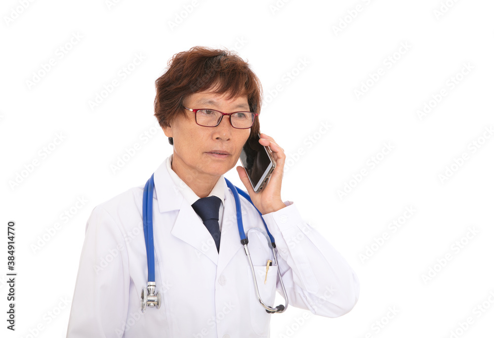 Female doctor in front of white background is answering the phone Female doctor in front of white background is answering the phone