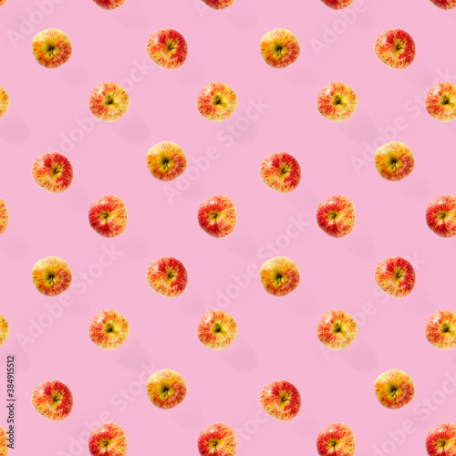 Seamless pattern with ripe apples. Tropical fruit abstract background. Apple seamless pattern on pink background.