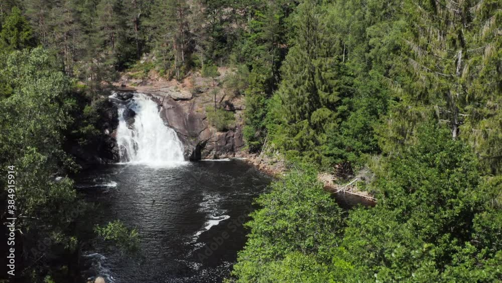 Kaja Waterfall or Kajafoss in Green Forest of Norway, Aerial Descent Kaja Waterfall or Kajafoss in Green Forest of Norway, Aerial Descent