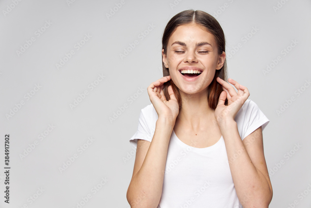Cheerful woman smile closed eyes white t-shirt Cheerful woman smile closed eyes white t-shirt