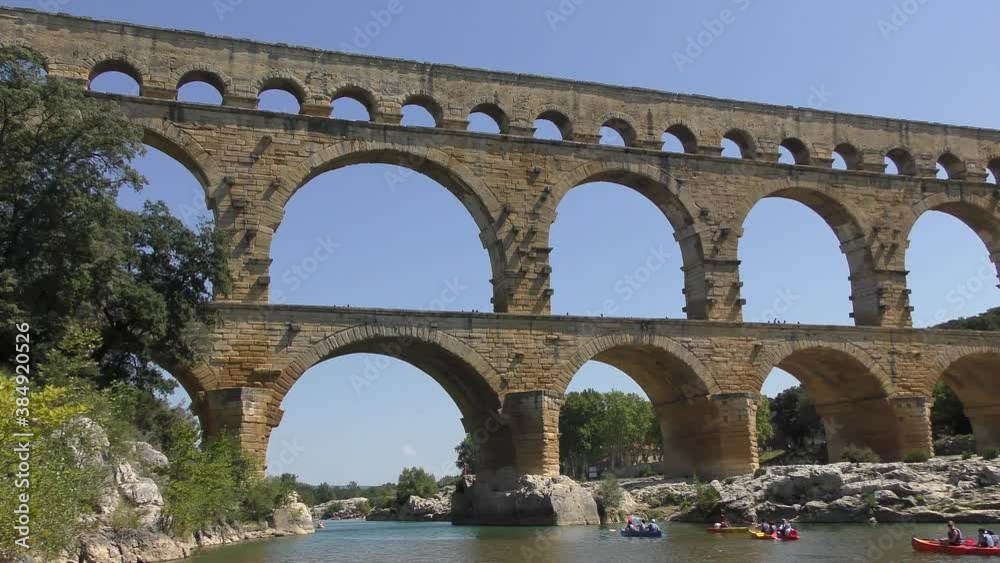 footage of Pont du Gard is an ancient Roman aqueduct that crosses the Gardon River near the town of Vers-Pont-du-Gard in southern France and popular tourist destination 4k quality