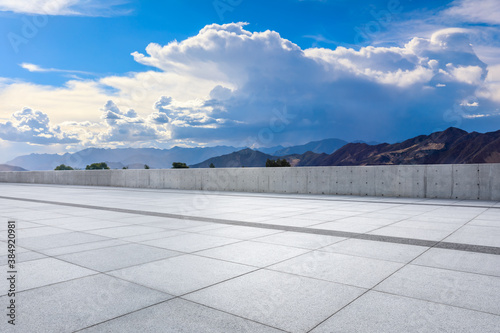 Empty square floor and mountain with sky clouds landscape. © ABCDstock