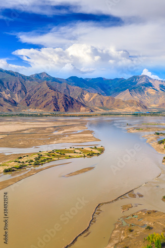 Aerial view of mountain and river with sky clouds natural landscape in Tibet,China.