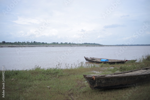 Tropical Seascape with a wooden boat.