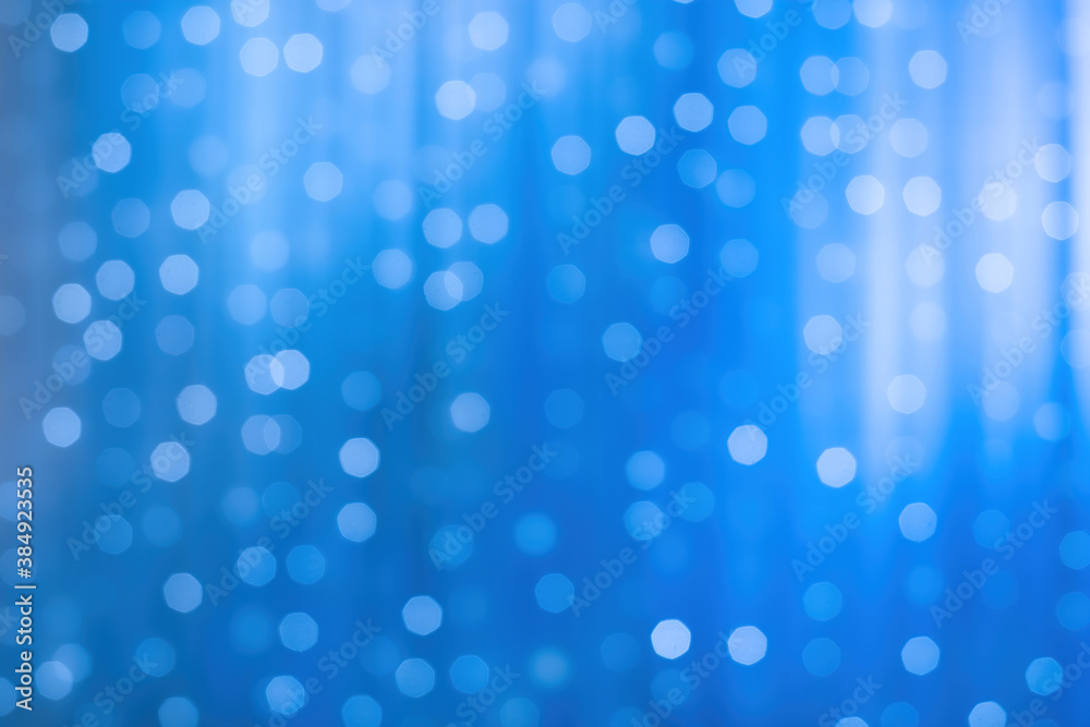 blurred focus of decorative lights in blue background