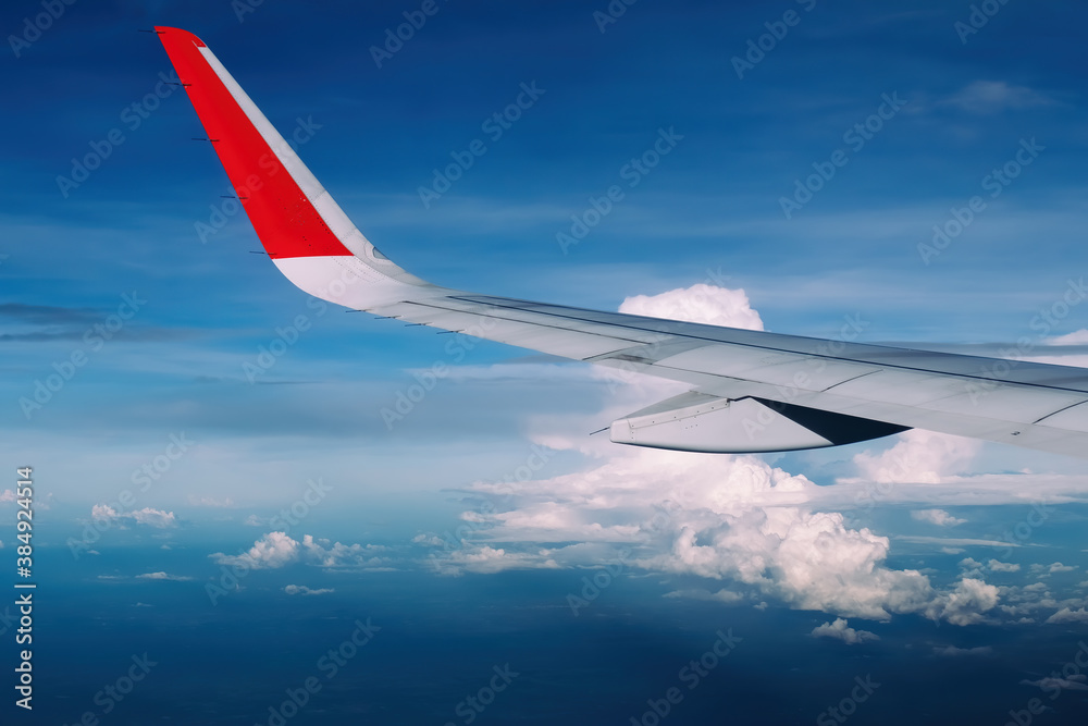 red winglet in graduated dark blue sky red winglet in graduated dark blue sky