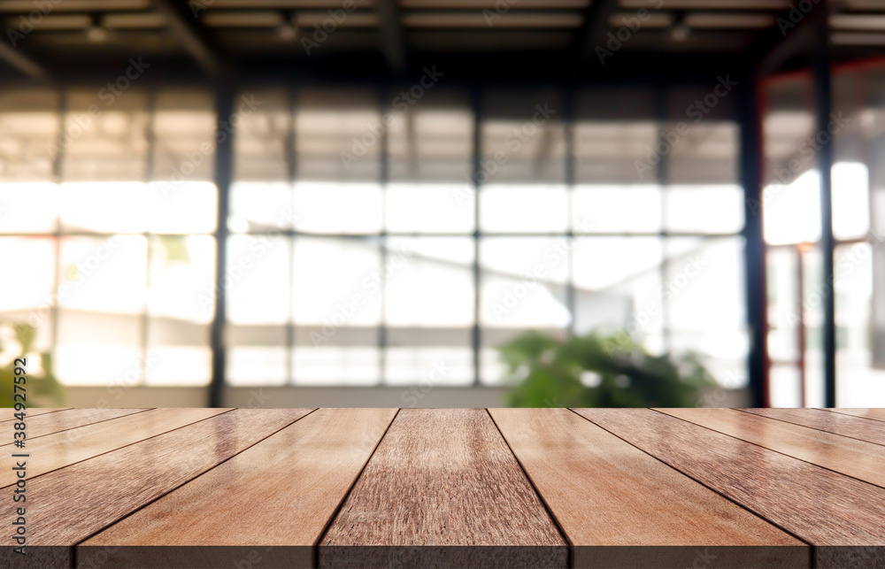 Empty wooden table top with lights bokeh on blur coffee shop background. Empty wooden table top with lights bokeh on blur coffee shop background.