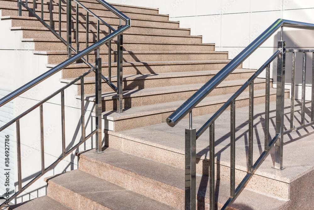 stairs with granite steps and metal handrails StockFoto Adobe Stock