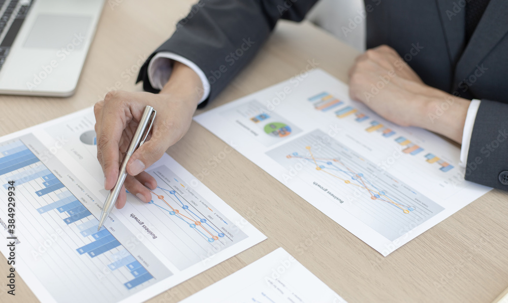 Finance workers are analyzing data in a private office. Finance workers are analyzing data in a private office.