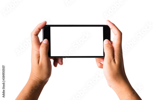 Woman hand playing game on smartphone blank screen. Female holding modern mobile phone horizontal position studio shot isolated on over white background with clipping mask path on the phone and screen