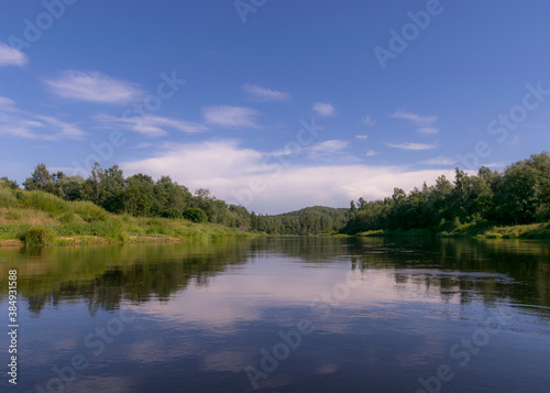 beautiful morning on the river, shore and tree reflections in the water, Gauja river, Latvia